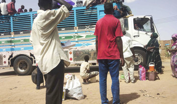 People board a truck as they leave Khartoum, Sudan, Monday, June 19, 2023. (AP)
