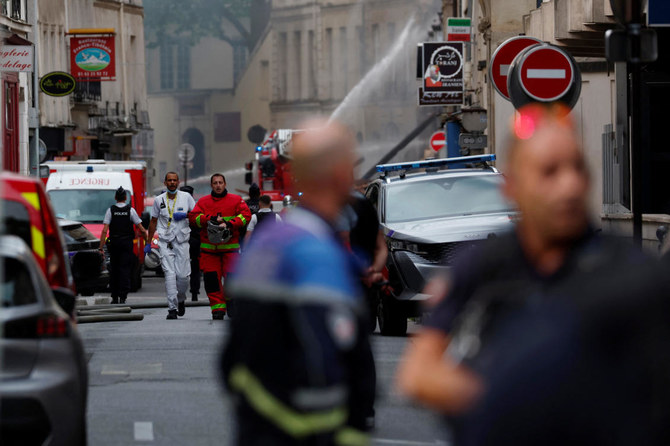 Rescuers comb through rubble of Paris building blast