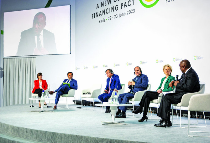 Paris conference urges global financial system overhaul to combat poverty and climate change 